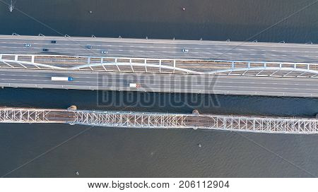 Aerial top view of bridge road automobile traffic of cars and railroad from above, transportation concept