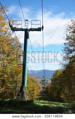Fall Foliage and ski lift in forest on Mount Mansfield in Vermont, USA.