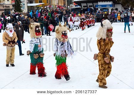 Razlog, Bulgaria - January 14, 2017: People in traditional carnival kuker costumes at Kukeri festival Starchevata