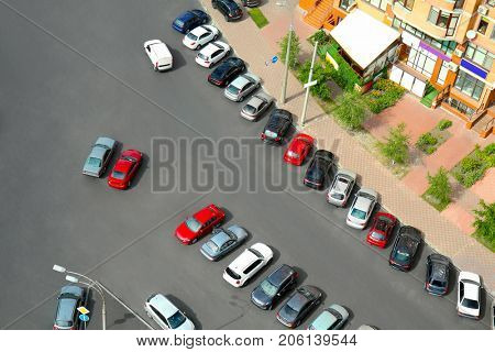 Parked cars near multistorey building