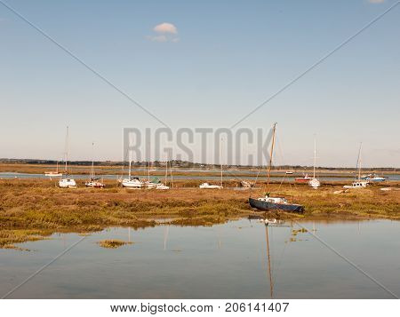 Row Boats Parked In Stream River Estuary In Tollesbury Maldon Essex