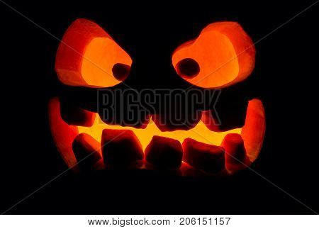 The Concept Of Halloween. The Ghastly, Ghastly Pumpkin Glows With A Fiery Yellow Light. Mystical Jac