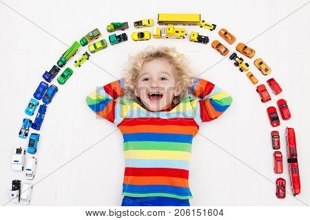 Little Boy Playing With Toy Cars. Toys For Kids.