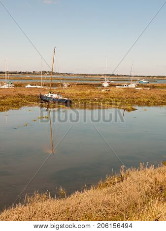 Row Boats Parked In Stream River Estuary In Tollesbury Maldon Essex