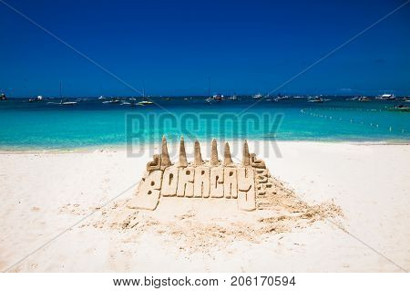 Sand tower castle at White beach of Boracay island . Philippines.
