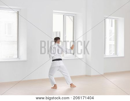 Male karate instructor training in dojo