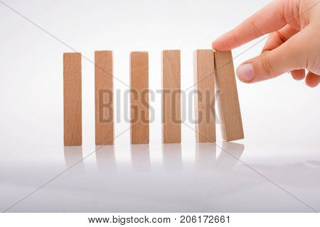 Hand Holding Wooden Domino