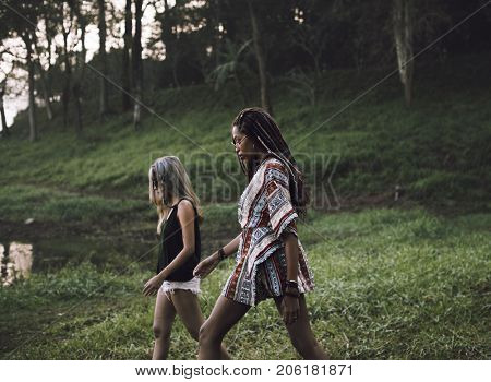 Women Walking by the Nature with Friends