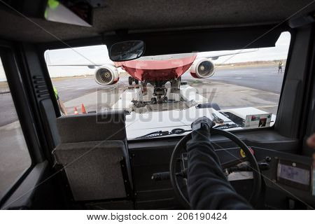 Airplane Seen Through Tow Truck