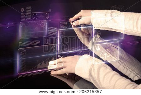 Male hands touching interactive table with purple cloudspace graphic on it 