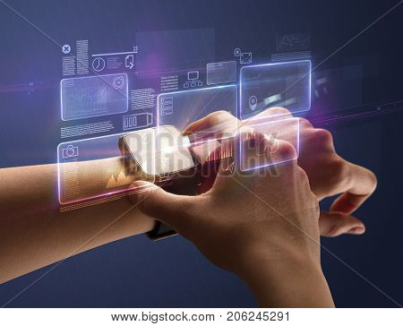 Female hand wearing smartwatch with statement labels around and dark background