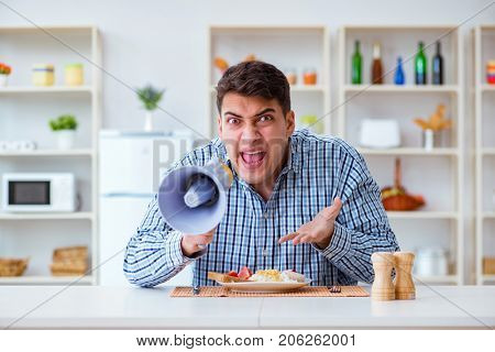 Husband with loudspeaker yelling at his wife