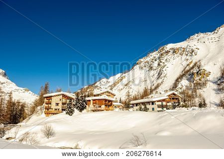 Alpine winter mountain landscape. French Alps covered with snow in sunny day. Val-d'Isere, France