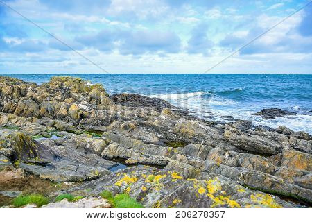 Landscape of Peel Hill rocky seashore in Isle of Man