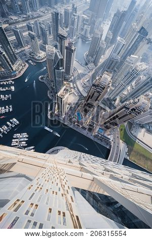 DUBAI, UAE - JAN 20, 2017: Cayan Tower top view in Dubai Marina area, Cayan is tallest building in world, which is twisted by 90 degrees