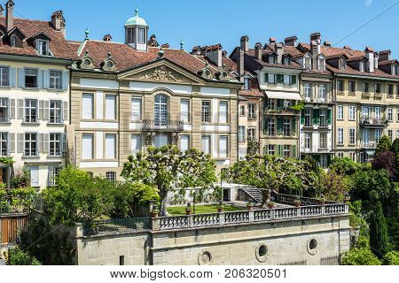 Bern Switzerland - May 26 2016: Upscale residential area with gardens near the Bern Cathedral and Aare River.