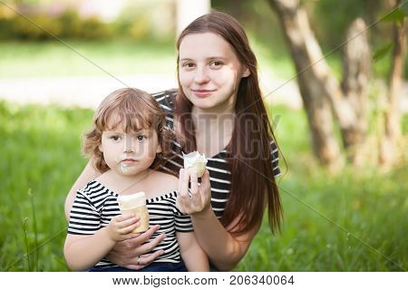 Lifestyle mother and child eating ice cream summer vacation family leisure time.