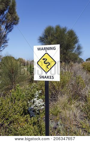 Snake Warning Sign erected by the Port Campbell National Park at the Twelve Apostles Sea Rocks on the Great Ocean Road