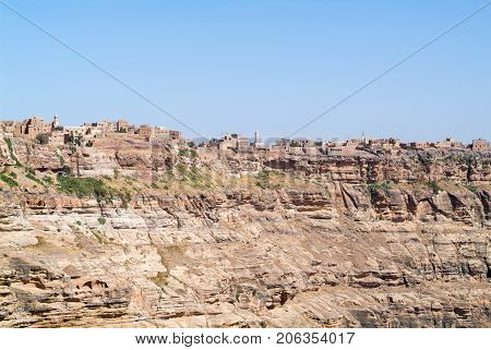 Kawkaban, Yemen - 19 January 2007: Red rocks and decorated old houses of Kawkaban fortified city Republic of Yemen