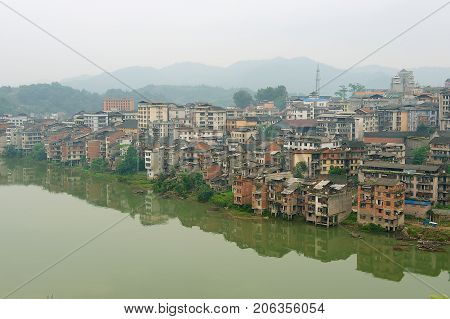 RONGSHUI, CHINA - MAY 07, 2009: View to the town of Rongshui in Guangxi across the river in Rongshui, China.