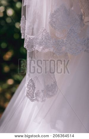 Wedding flowers bouquet and buttoniere in bride and groom hand