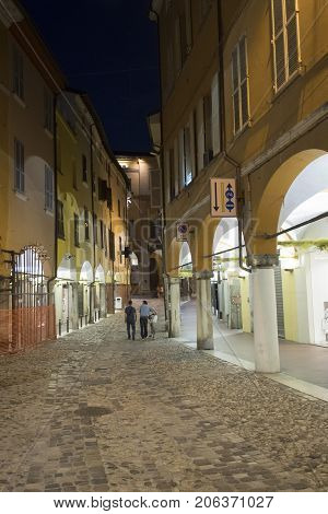 Cesena (Emilia Romagna Italy): old street with portico at evening