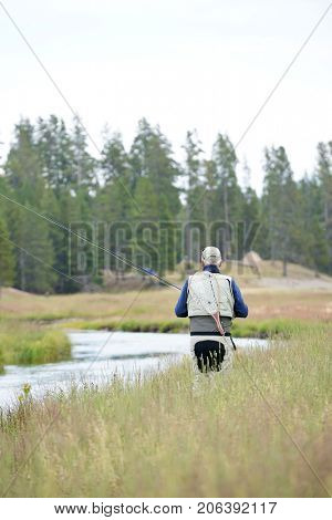 Fly-fisherman fishing in the Gallatin River, Montana
