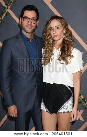 LOS ANGELES - SEP 25:  Tom Ellis, Megan Oppenheimer at the FOX Fall Premiere Party 2017 at the Catch on September 25, 2017 in West Hollywood, CA