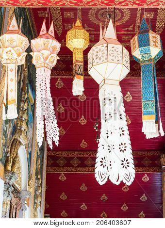 Traditional Thai lantern from the bamboo and paper is hanging on the church for good luck in the northern of Thailand.