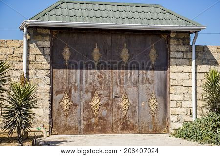 Iron gates for the entrance to the cottage