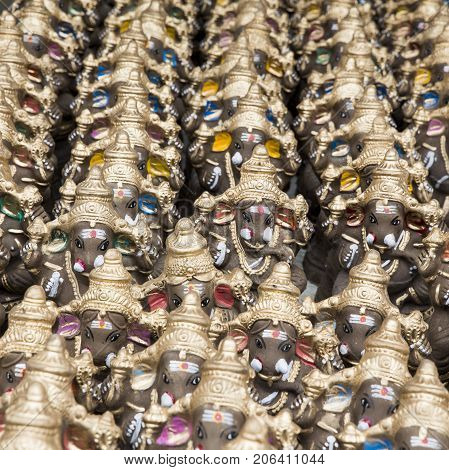 Many hand crafted Ganesha idol clay statues displayed in the market during Ganesh Festival.
