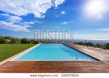 Modern endless infinity pool. With views of the landscape.