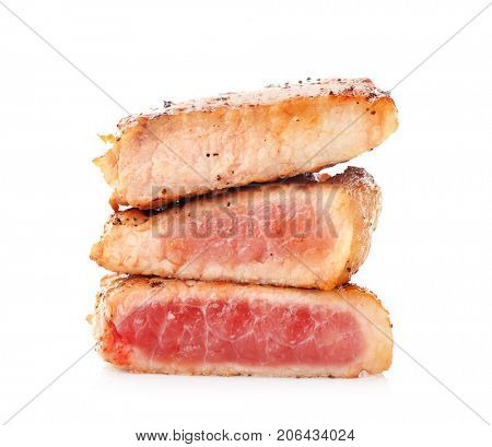 Tasty steaks on white background