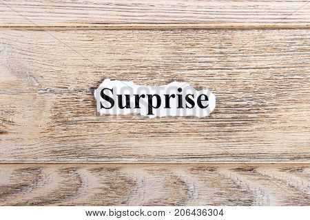 Surprise text on paper. Word Surprise on torn paper. Concept Image.