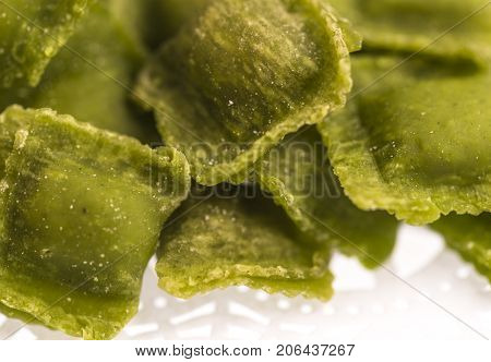 Raw handmade green agnolotti, type of ravioli, typical Italian egg pasta from Piedmont, Italy