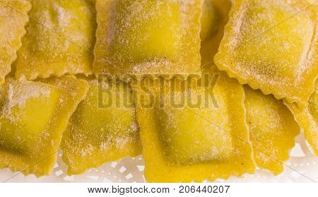 Raw handmade agnolotti, type of ravioli, typical Italian egg pasta from Piedmont, Italy