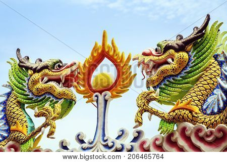 colorful dragon statue on roof at chainese temple