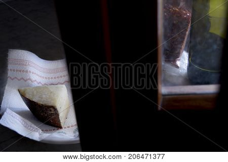 sardinian pecorino illumined from light of a window