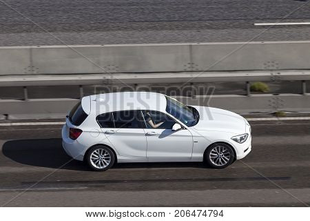 Frankfurt Germany - Sep 19 2017: White BMW 1 Series driving on the highway in Germany