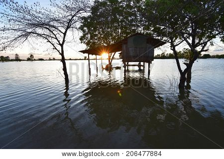 Evening view Homes flooded in the monsoon. South East Asia