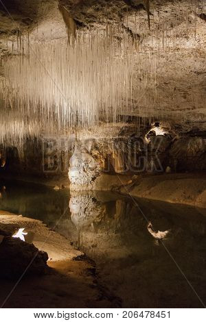Huge cave with water reflection in france