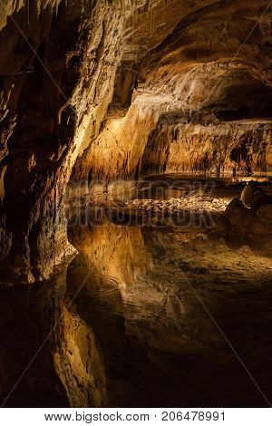 Huge cave with water reflection in france