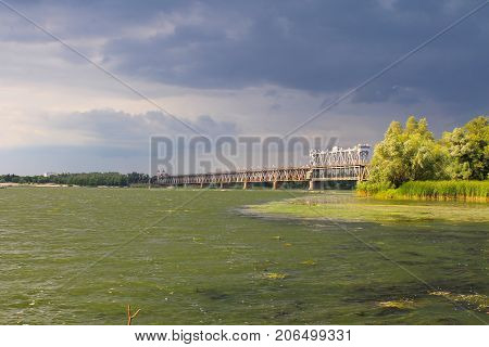 Bridge Across River Dnieper And Storm Clouds In Sky