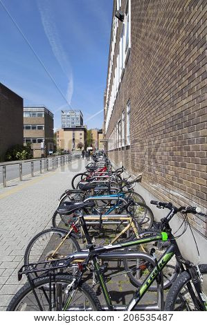 Swansea, UK: May 04, 2016: Bicycles are secured against theft at Swansea University Singleton Campus.