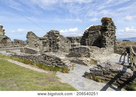 Tintagel, Cornwall, UK: April 14, 2016: An ancient building at Tintagel castle. Tintagel is maintained by English Heritage who are also responsible for many other ancient sites across England.