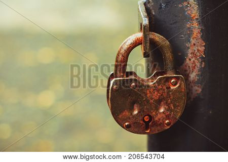 iron lock hanging on the iron fence