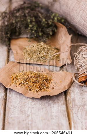 Medical herbal tea infusions. Quackery closeup. Alternative medicine in focus on foreground, homemade health herb ingredients concept