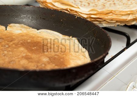 pancakes fried in a pan . Photos in the studio