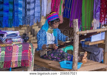 KAYAN STATE MYANMAR - SEP 09 : Portrait of Kayan tribe woman in Kayan state Myanmar on September 09 2017 Kayan tribe woman are well known for wearing neck rings.