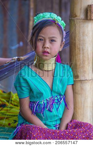 KAYAN STATE MYANMAR - SEP 09 : Portrait of Kayan tribe girl in Kayan state Myanmar on September 09 2017 Kayan tribe woman are well known for wearing neck rings.